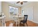 Bright dining room featuring hardwood floors, ceiling fan, and a window that lets in lots of natural light at 128 Lake Pointe Dr., Murrells Inlet, SC 29576