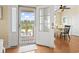 Bright foyer with decorative glass front door and dining area view at 128 Lake Pointe Dr., Murrells Inlet, SC 29576