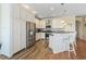 Beautiful kitchen with stainless steel appliances, white cabinetry and hardwood floors at 128 Lake Pointe Dr., Murrells Inlet, SC 29576