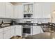 Modern kitchen with stainless steel appliances, tile backsplash, and black granite countertops at 128 Lake Pointe Dr., Murrells Inlet, SC 29576
