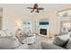 Comfortable seating arrangement and fireplace in cozy living room area with decorative features at 128 Lake Pointe Dr., Murrells Inlet, SC 29576