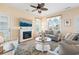 Cozy living room with fireplace, ceiling fan, comfortable seating and lots of light at 128 Lake Pointe Dr., Murrells Inlet, SC 29576