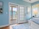 View from main bedroom, leading to the wooden balcony, showing the outdoor view at 128 Lake Pointe Dr., Murrells Inlet, SC 29576