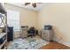 Office space featuring desk, printer and blue patterned rug over hardwood floors at 128 Lake Pointe Dr., Murrells Inlet, SC 29576