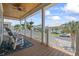 Relaxing porch area with ceiling fan, views of the neighborhood, and rocking chair at 128 Lake Pointe Dr., Murrells Inlet, SC 29576
