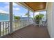 Inviting porch with outdoor seating area and wood ceilings offering picturesque views at 128 Lake Pointe Dr., Murrells Inlet, SC 29576