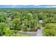 Aerial view of property showing the surrounding trees and proximity to a pond at 15 Cherbourg Ct., Pawleys Island, SC 29585