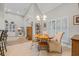 Bright dining area features a modern light fixture and natural light from the windows at 15 Cherbourg Ct., Pawleys Island, SC 29585