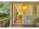 Inviting entrance to the home with a wood door and plenty of natural light at 15 Cherbourg Ct., Pawleys Island, SC 29585