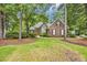 Charming brick home with lush landscaping and mature trees in a desirable neighborhood at 15 Cherbourg Ct., Pawleys Island, SC 29585