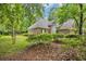 Charming brick home featuring manicured shrubs and a well-maintained lawn at 15 Cherbourg Ct., Pawleys Island, SC 29585