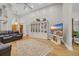 Spacious living room featuring hardwood floors, a large hutch, and stylish decor at 15 Cherbourg Ct., Pawleys Island, SC 29585