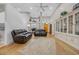 Bright living room with high ceilings, hardwood floors, and a large decorative rug at 15 Cherbourg Ct., Pawleys Island, SC 29585