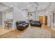 Open living space with hardwood floors, modern lighting, and comfortable seating at 15 Cherbourg Ct., Pawleys Island, SC 29585