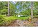 Scenic pond with a fountain, lush greenery, and a serene atmosphere at 15 Cherbourg Ct., Pawleys Island, SC 29585