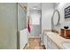 Bathroom featuring double sinks, large mirror, and a shower with glass doors at 156 Hummingbird Ct., Myrtle Beach, SC 29579