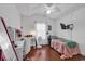 Bright bedroom with ceiling fan, hardwood floors, large window and desk at 156 Hummingbird Ct., Myrtle Beach, SC 29579