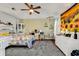 Comfortable bedroom with decorative rug, ceiling fan and sunflower decor at 156 Hummingbird Ct., Myrtle Beach, SC 29579