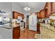 Well-lit kitchen featuring granite countertops, wood cabinets, and stainless steel appliances at 156 Hummingbird Ct., Myrtle Beach, SC 29579