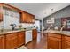 Kitchen area with granite countertops, wood cabinetry and hardwood floors at 156 Hummingbird Ct., Myrtle Beach, SC 29579