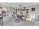 Enclosed patio features a glass-topped table, four chairs, and mounted TV at 156 Hummingbird Ct., Myrtle Beach, SC 29579