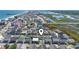 Coastal neighborhood aerial view near the waterway and ocean featuring colorful beach homes at 161 Easy St., Garden City Beach, SC 29576