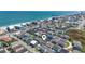 Aerial view showing a home's proximity to the beach and the surrounding coastal community at 161 Easy St., Garden City Beach, SC 29576