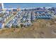 Ocean view aerial of a charming coastal neighborhood with colorful beach houses close to the ocean at 161 Easy St., Garden City Beach, SC 29576