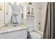 Clean and bright bathroom with modern fixtures, granite countertop, and ample storage space at 161 Easy St., Garden City Beach, SC 29576