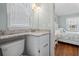 A view into the bathroom with granite counter, vanity and toilet at 161 Easy St., Garden City Beach, SC 29576