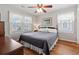 Comfortable bedroom with hardwood floors, natural light, and neutral tones for relaxation at 161 Easy St., Garden City Beach, SC 29576