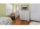 Bedroom featuring a dresser and a view into the bathroom at 161 Easy St., Garden City Beach, SC 29576