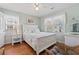 Bright and airy bedroom with white furniture, soft colors, and a beachy, coastal vibe at 161 Easy St., Garden City Beach, SC 29576
