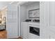Laundry room featuring washer and dryer with decorative door and coastal decor at 161 Easy St., Garden City Beach, SC 29576