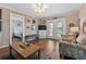 Cozy living room featuring wood paneling, comfortable seating, and access to the porch at 161 Easy St., Garden City Beach, SC 29576