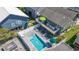 Aerial view of a backyard pool, deck, and outdoor seating area, perfect for summer relaxation at 161 Easy St., Garden City Beach, SC 29576