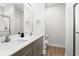 Bathroom featuring dual sinks, grey wood cabinetry, quartz countertops, and tile floors at 1620 San Andres Ave., Little River, SC 29566