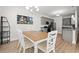 Charming dining room with a wooden table, upholstered chairs, and modern decor at 1620 San Andres Ave., Little River, SC 29566