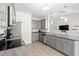 Bright kitchen featuring gray cabinets, stainless steel appliances, and modern fixtures at 1620 San Andres Ave., Little River, SC 29566