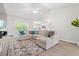 Spacious living room with a large sectional sofa, stylish rug, and a vaulted ceiling at 1620 San Andres Ave., Little River, SC 29566