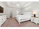 Bright bedroom featuring a tray ceiling, an expansive layout and soft carpeted floors at 1620 San Andres Ave., Little River, SC 29566
