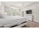 Bright bedroom featuring a large flat screen television, tray ceiling, an expansive layout at 1620 San Andres Ave., Little River, SC 29566