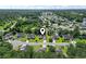 An aerial view of a neighborhood showcases the home's location with lush greenery and nearby amenities at 176 Whispering Oaks Dr., Longs, SC 29568