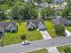 An aerial view shows a neighborhood with houses, trees, and landscaping, and a street with one car at 176 Whispering Oaks Dr., Longs, SC 29568