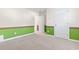 Neutral carpeted bedroom with green accent paint, white doors, and white trim at 176 Whispering Oaks Dr., Longs, SC 29568