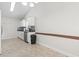Open eat-in kitchen featuring stainless steel appliances and neutral tile flooring at 176 Whispering Oaks Dr., Longs, SC 29568