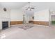 Comfortable living room featuring a fireplace, an open layout, and easy access to hallway and other rooms at 176 Whispering Oaks Dr., Longs, SC 29568