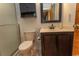 Bathroom features a modern vanity, framed mirror, toilet, and glass-enclosed shower at 18 Pine Valley Ln., Surfside Beach, SC 29575