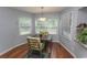Sunny dining area featuring large windows, comfortable seating and modern light fixture at 18 Pine Valley Ln., Surfside Beach, SC 29575