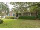 All brick, one story home with manicured landscaping including a green lawn and green hedges in front of the home at 18 Pine Valley Ln., Surfside Beach, SC 29575
